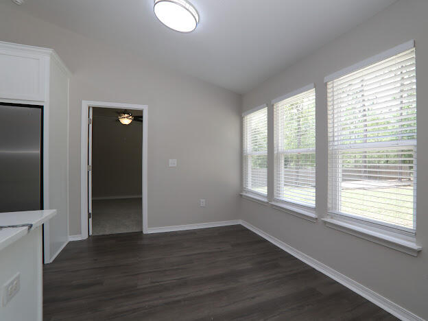 6330 Possum Ridge Road Crestview, FL 32539 - Photo 9 of 22 a view of an empty room with wooden floor and a window