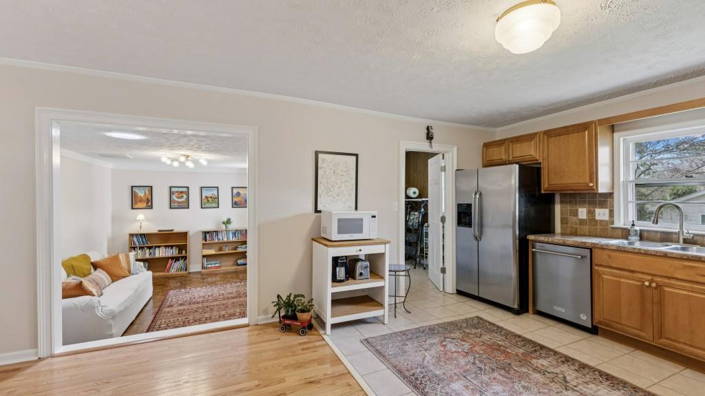 3972 North Peachtree Road Atlanta, GA 30341 - Photo 14 of 28 a kitchen with stainless steel appliances granite countertop a refrigerator and a stove top oven