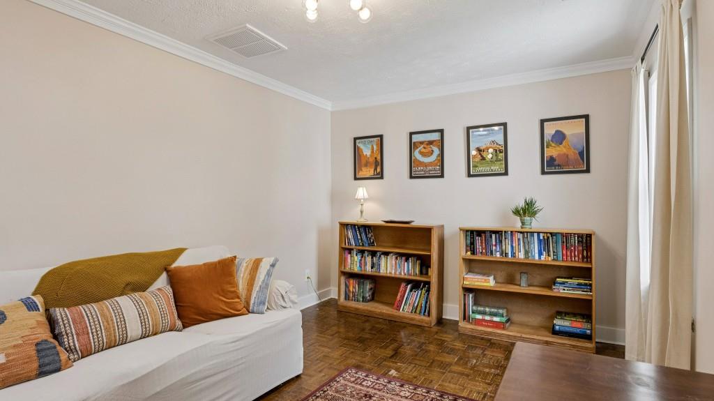 3972 North Peachtree Road Atlanta, GA 30341 - Photo 17 of 28 a living room with furniture and a book shelf