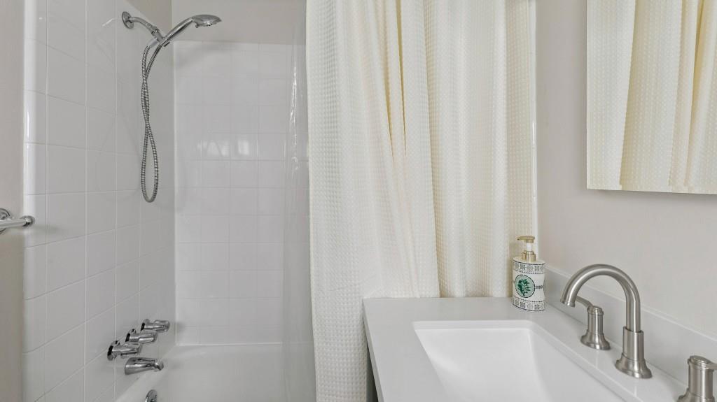 3972 North Peachtree Road Atlanta, GA 30341 - Photo 20 of 28 a bathroom with a sink and a bathtub