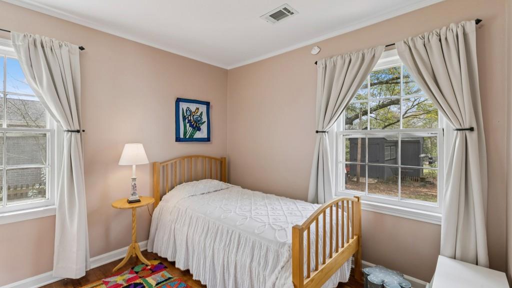 3972 North Peachtree Road Atlanta, GA 30341 - Photo 21 of 28 a bedroom with a bed and a window