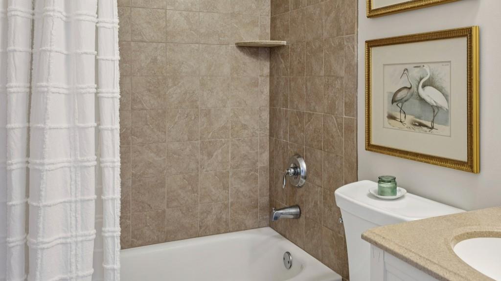 3972 North Peachtree Road Atlanta, GA 30341 - Photo 22 of 28 a bathroom with a sink and a bathtub