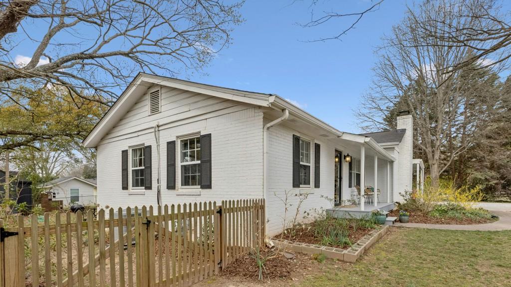 3972 North Peachtree Road Atlanta, GA 30341 - Photo 27 of 28 a front view of a house with a yard