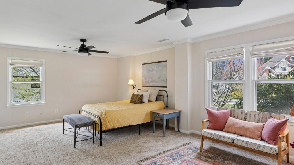 3972 North Peachtree Road Atlanta, GA 30341 - Photo 4 of 28 a bedroom with a bed a couch and window