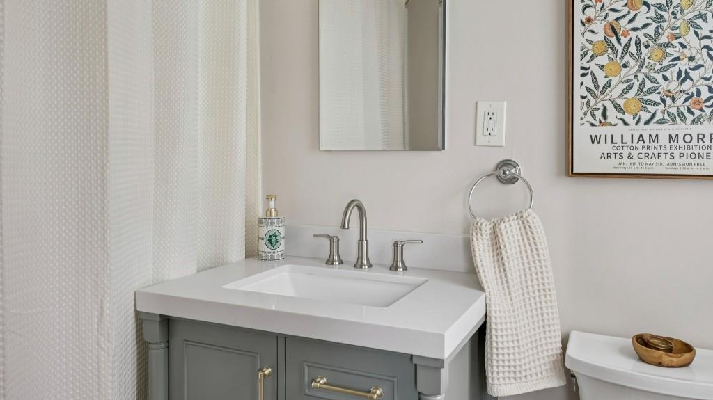 3972 North Peachtree Road Atlanta, GA 30341 - Photo 5 of 28 a bathroom with a sink and a mirror
