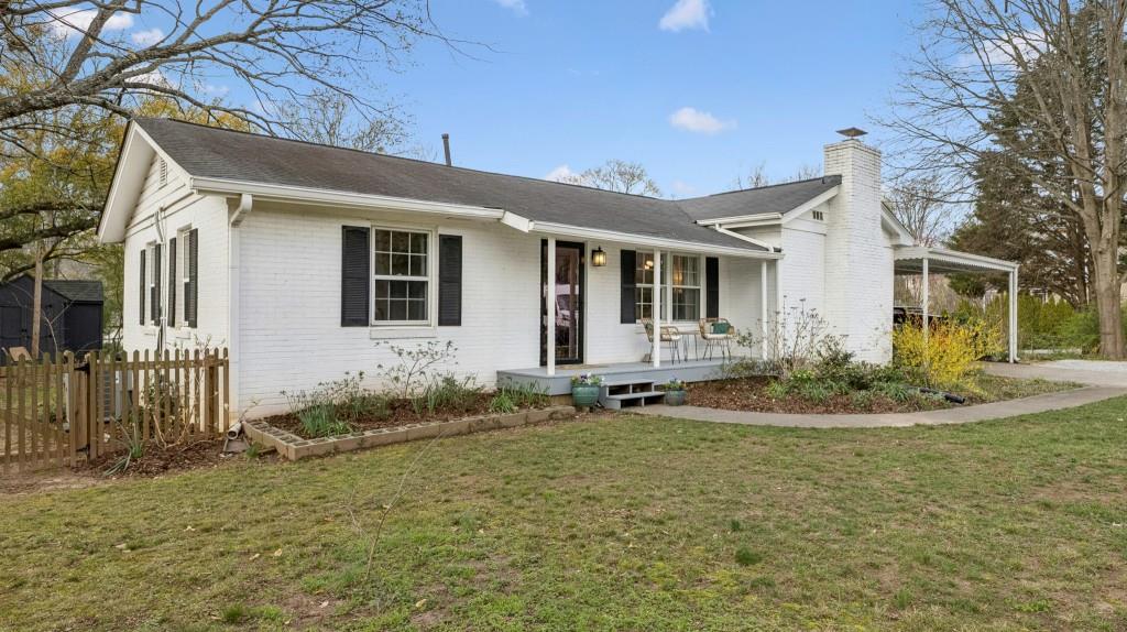 3972 North Peachtree Road Atlanta, GA 30341 - Photo 7 of 28 a front view of a house with garden