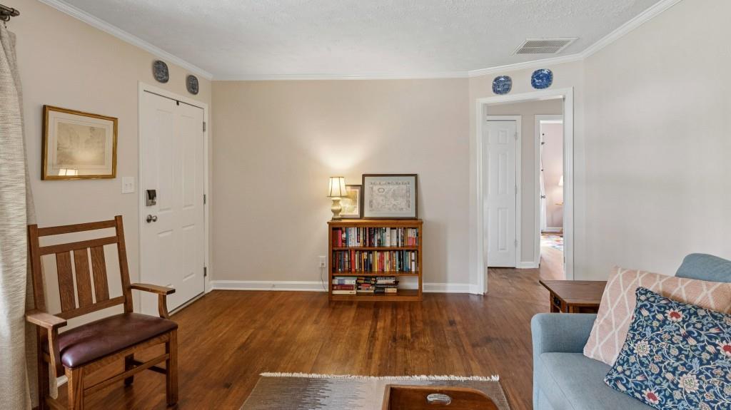 3972 North Peachtree Road Atlanta, GA 30341 - Photo 8 of 28 a living room with furniture and a wooden floor