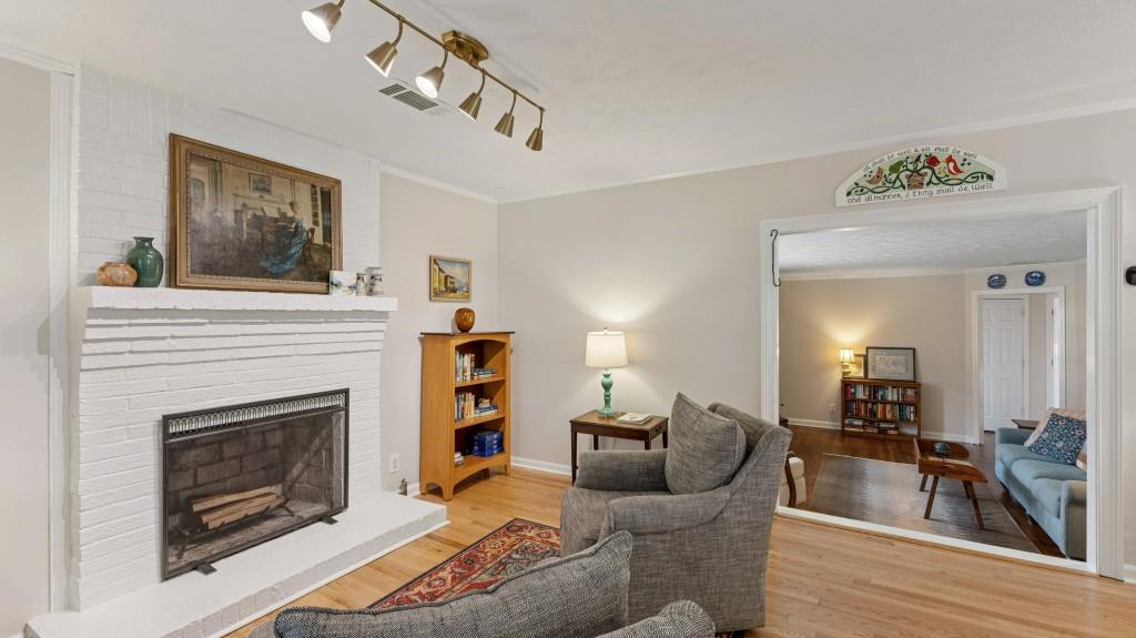 3972 North Peachtree Road Atlanta, GA 30341 - Photo 9 of 28 a living room with furniture and a fireplace