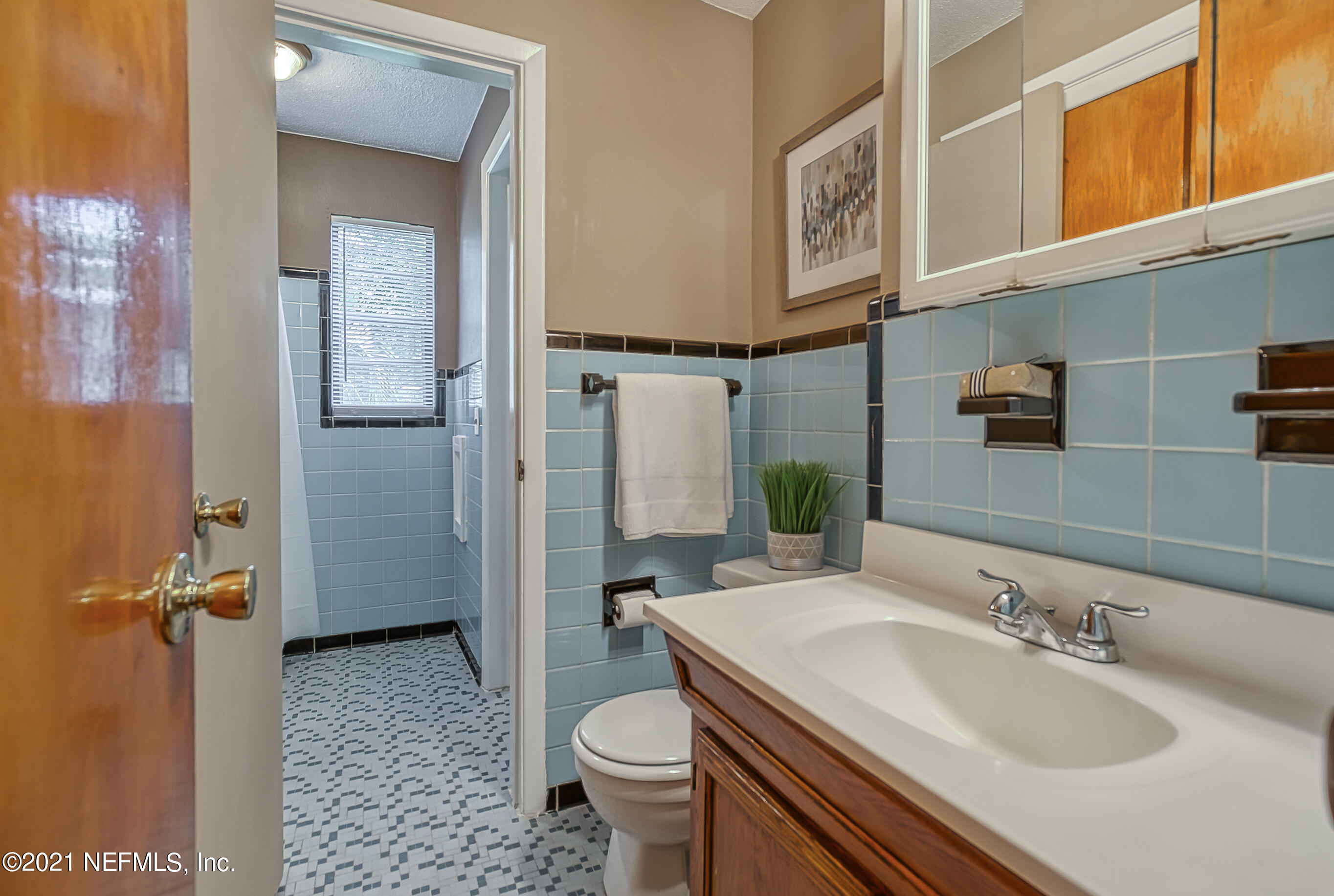 6833 Provost Road North Jacksonville, FL 32216 - Photo 17 of 31 a bathroom with a granite countertop sink toilet and shower