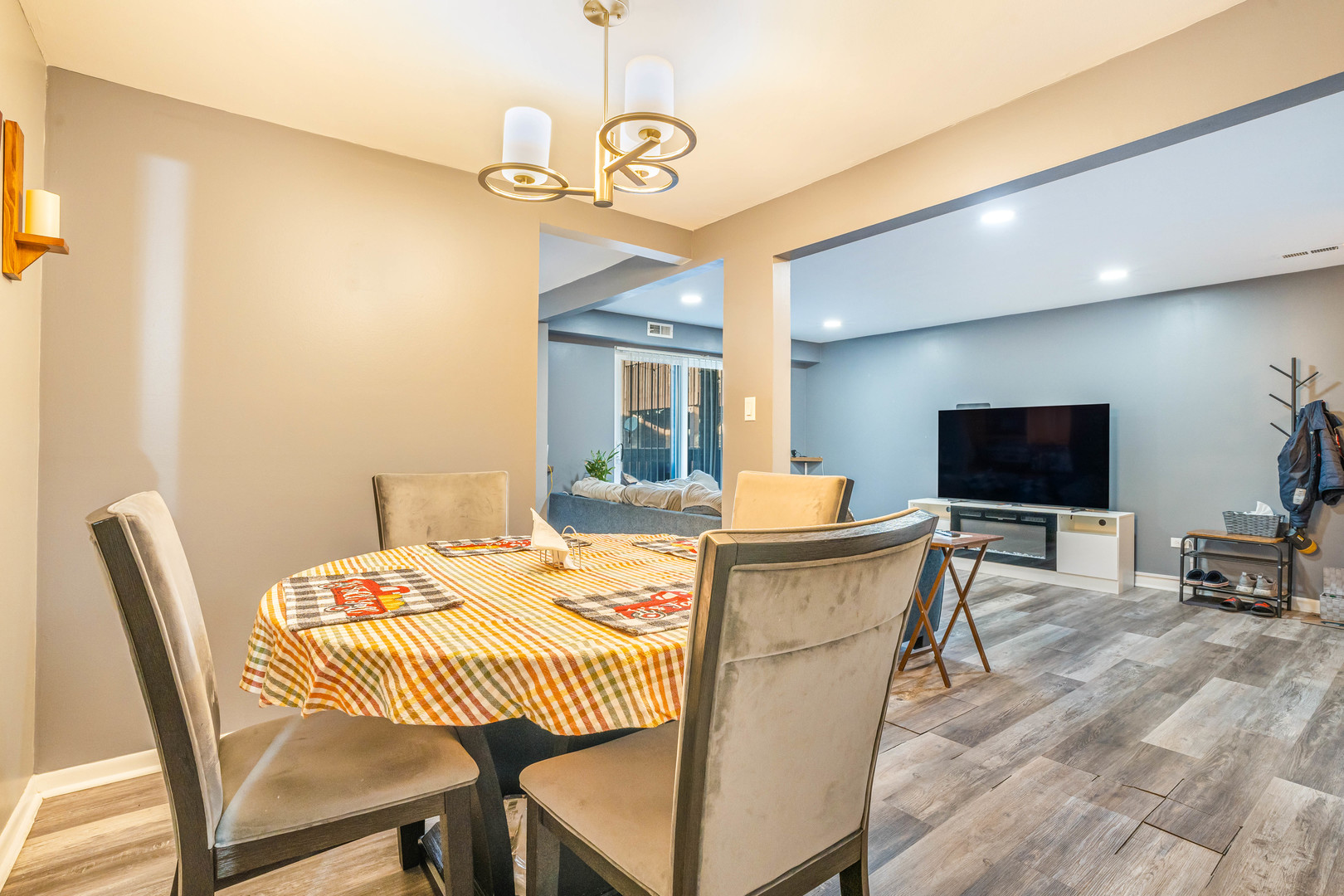 4553 West 56th Street, Unit 204 Chicago, IL 60629 - Photo 7 of 16 a view of a dining room with furniture window and wooden floor