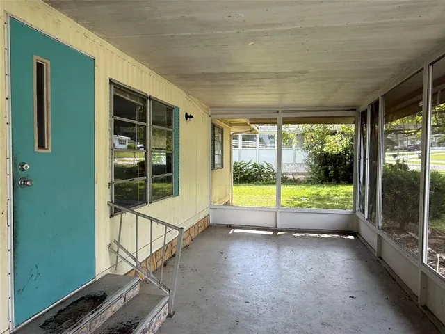 a view of a porch with a backyard