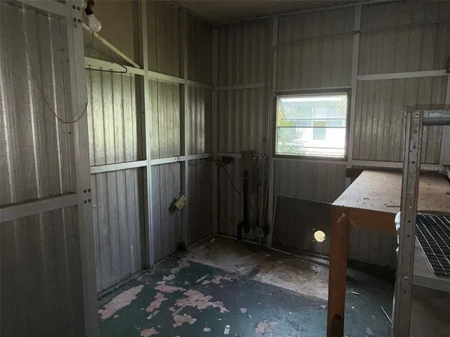 a house that has a tree in front of it