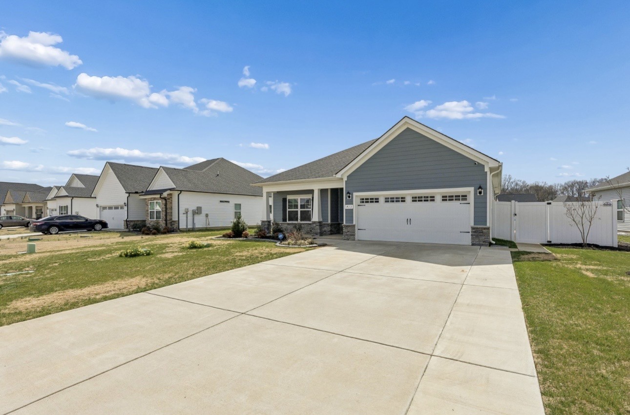 413 Ruby Cate Way Murfreesboro, TN 37128 - Photo 4 of 31 a front view of a house with a yard