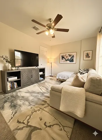 a living room with furniture and a flat screen tv