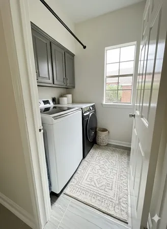 a utility room with a sink a washer and dryer