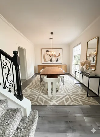 a view of a dining room with furniture