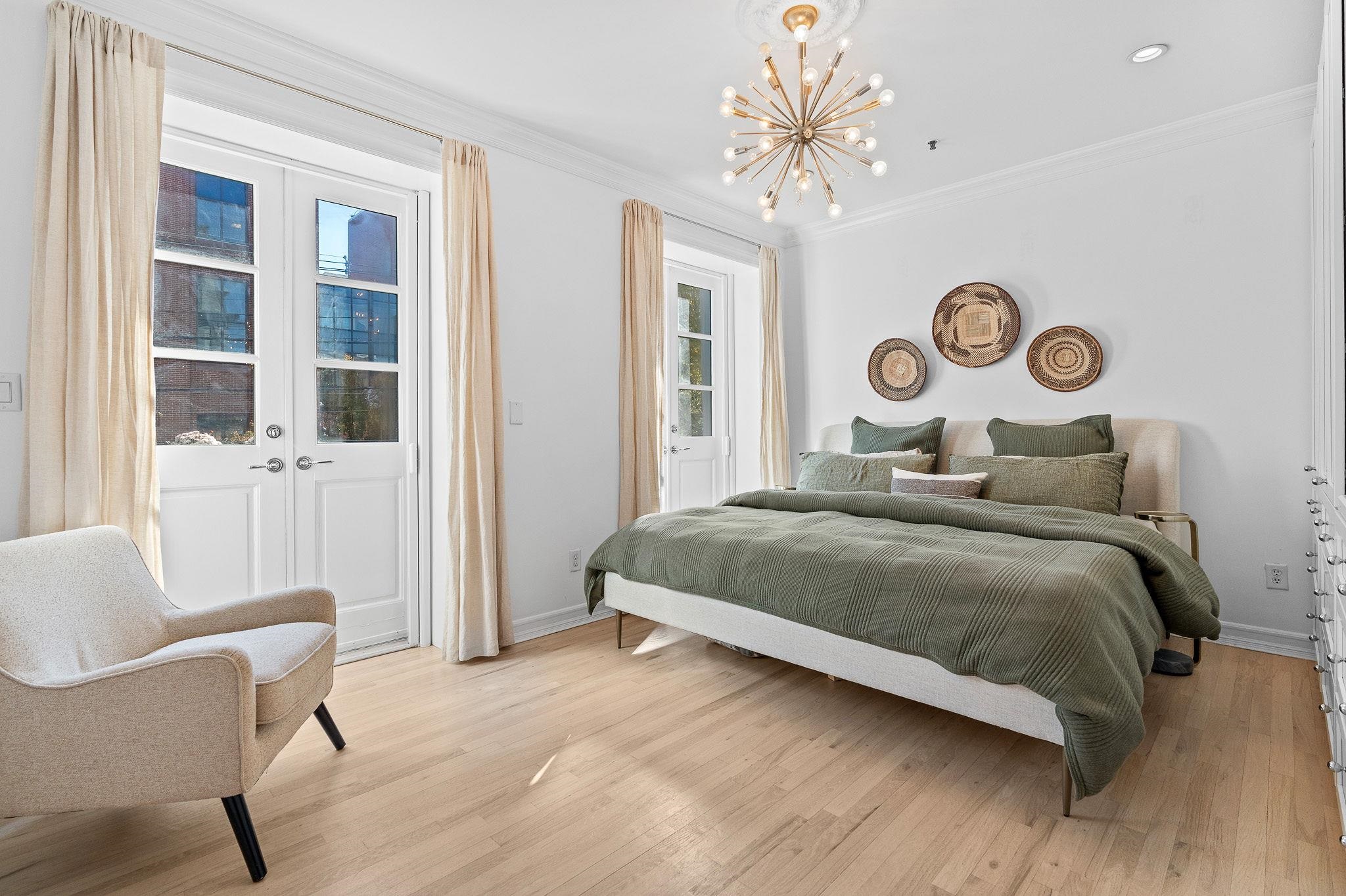 600 Hudson Street, Unit 2B Hoboken, NJ 07030 - Photo 14 of 20 a bedroom with a bed and a table with chair
