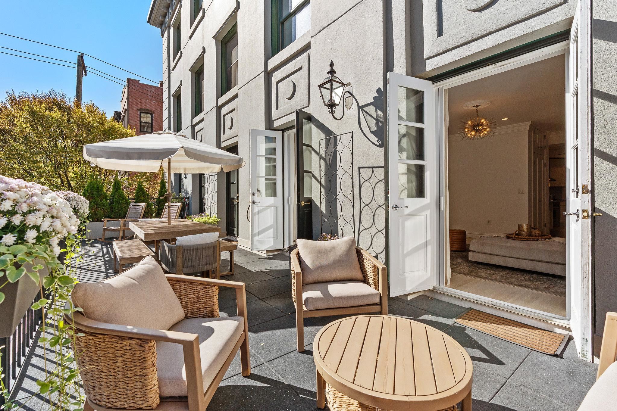 600 Hudson Street, Unit 2B Hoboken, NJ 07030 - Photo 16 of 20 a view of a patio with couches table and chairs