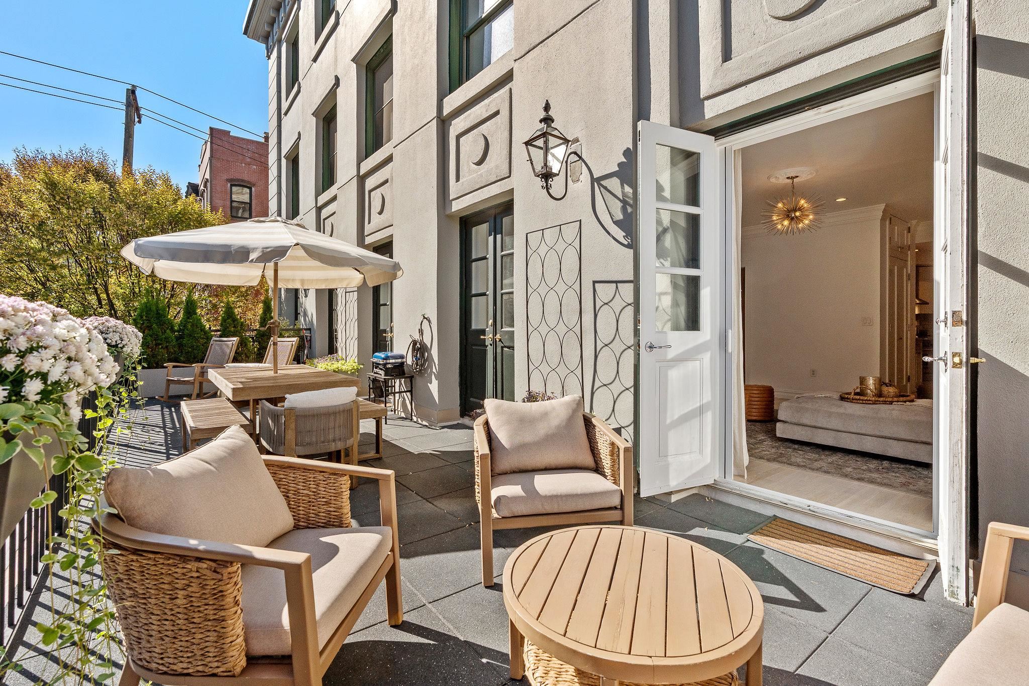 600 Hudson Street, Unit 2B Hoboken, NJ 07030 - Photo 18 of 20 a view of a patio with couches table and chairs
