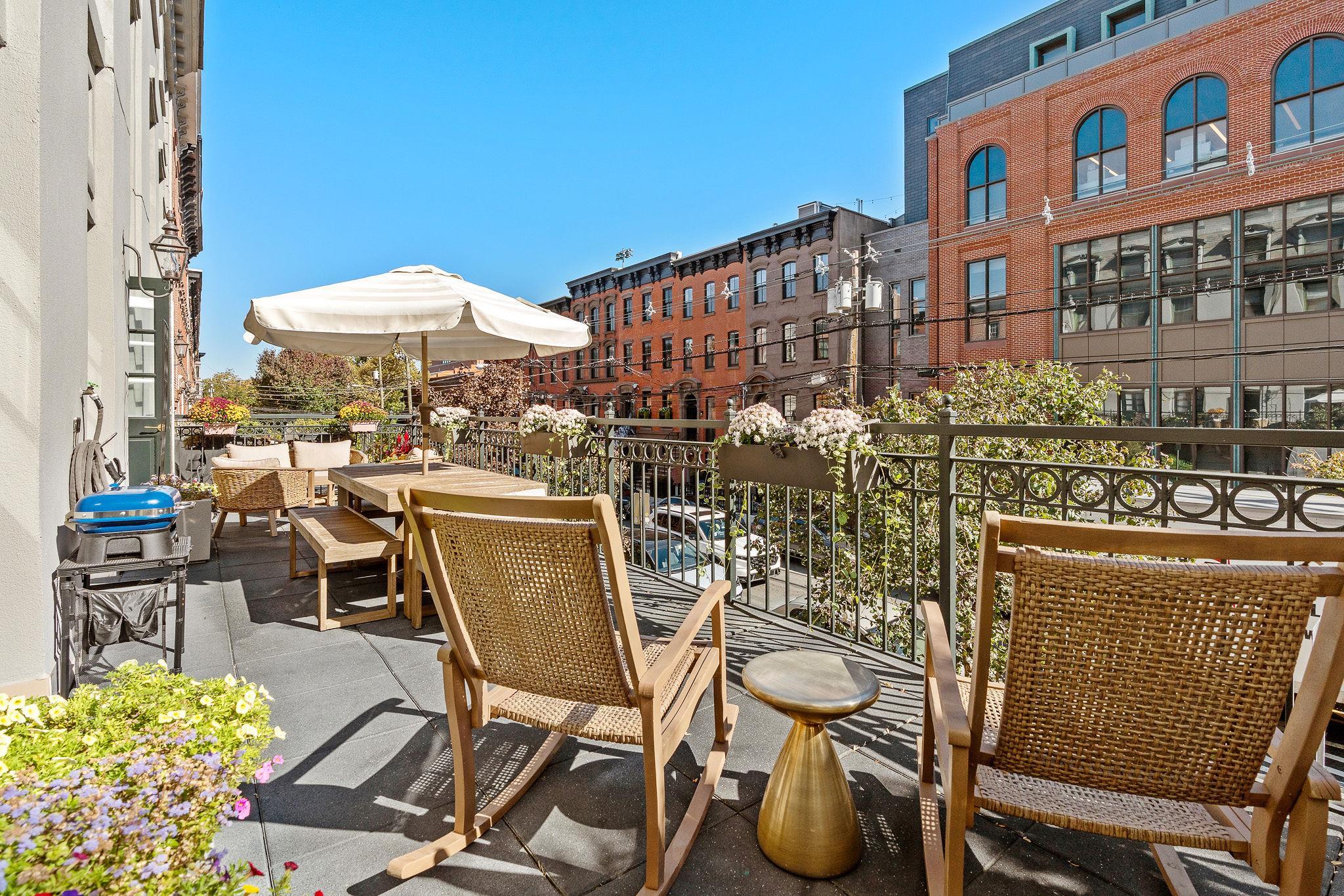 600 Hudson Street, Unit 2B Hoboken, NJ 07030 - Photo 19 of 20 a view of a chairs and table in a patio