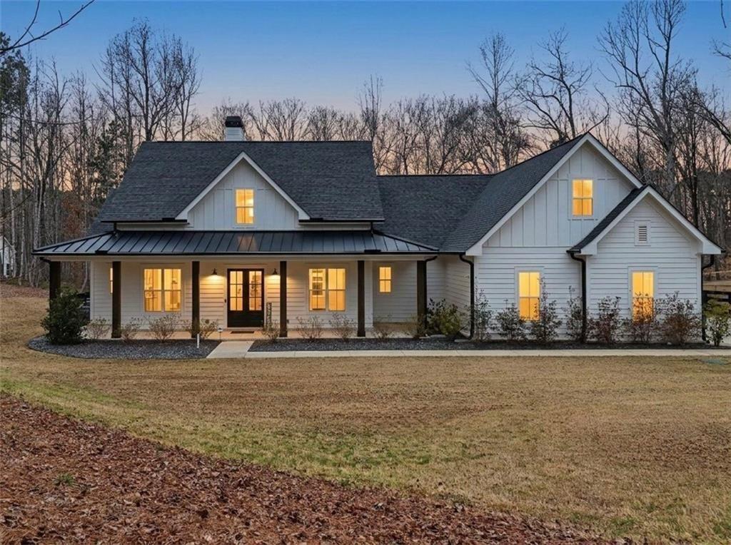 877 Arnold Mill Road Woodstock, GA 30188 - Photo 2 of 62 a front view of a house with a yard