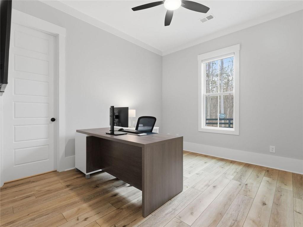 877 Arnold Mill Road Woodstock, GA 30188 - Photo 41 of 62 a view of workspace with wooden floor cabinet and window