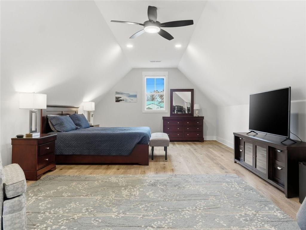 877 Arnold Mill Road Woodstock, GA 30188 - Photo 44 of 62 a bedroom with a bed and a flat screen tv