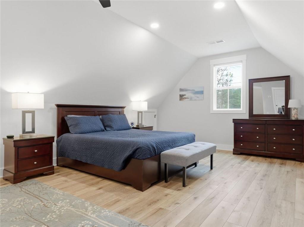 877 Arnold Mill Road Woodstock, GA 30188 - Photo 45 of 62 a bedroom with a bed and a dresser