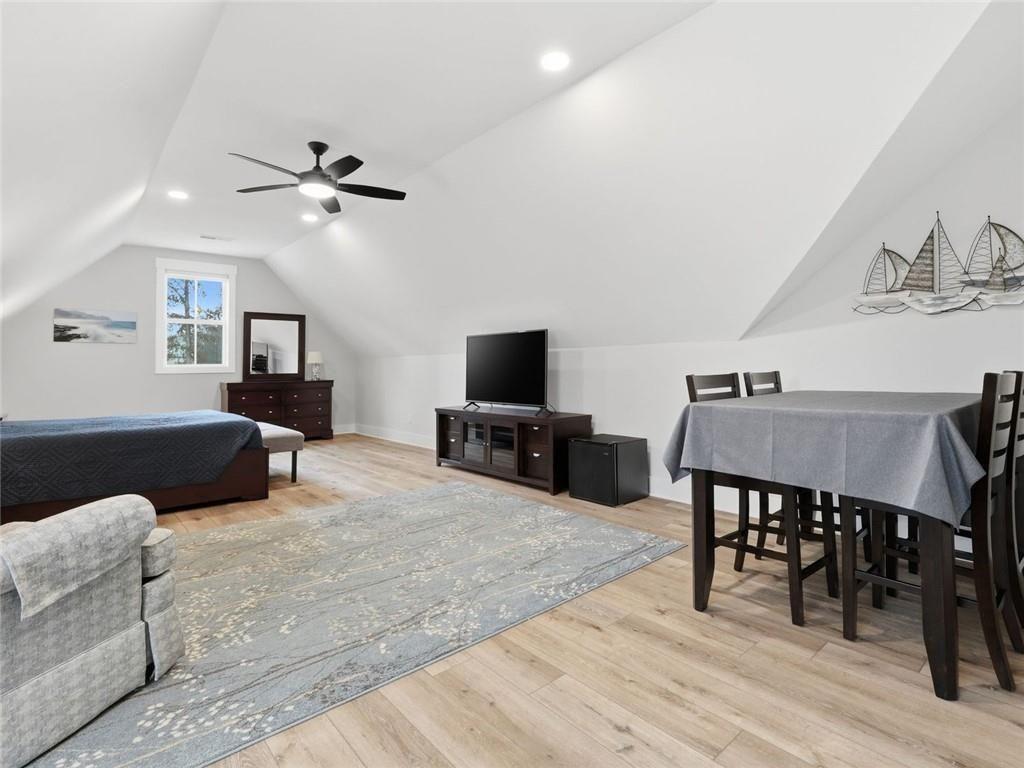 877 Arnold Mill Road Woodstock, GA 30188 - Photo 46 of 62 a view of a livingroom with furniture and a flat screen tv