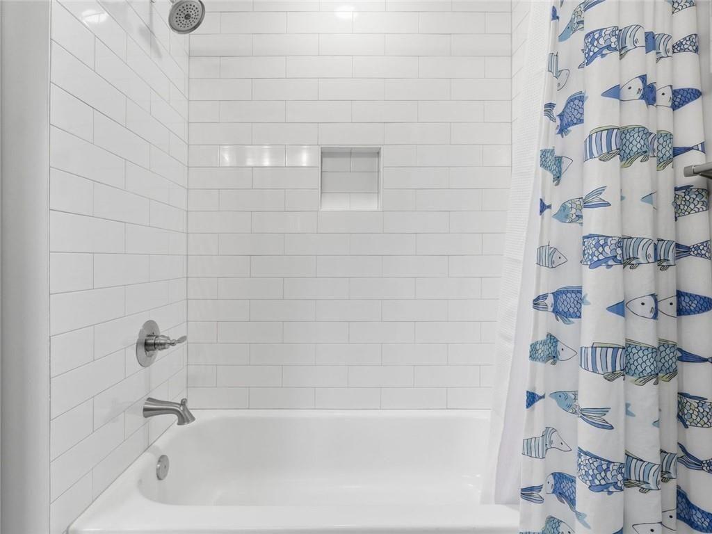 877 Arnold Mill Road Woodstock, GA 30188 - Photo 49 of 62 a bathroom with a bathtub