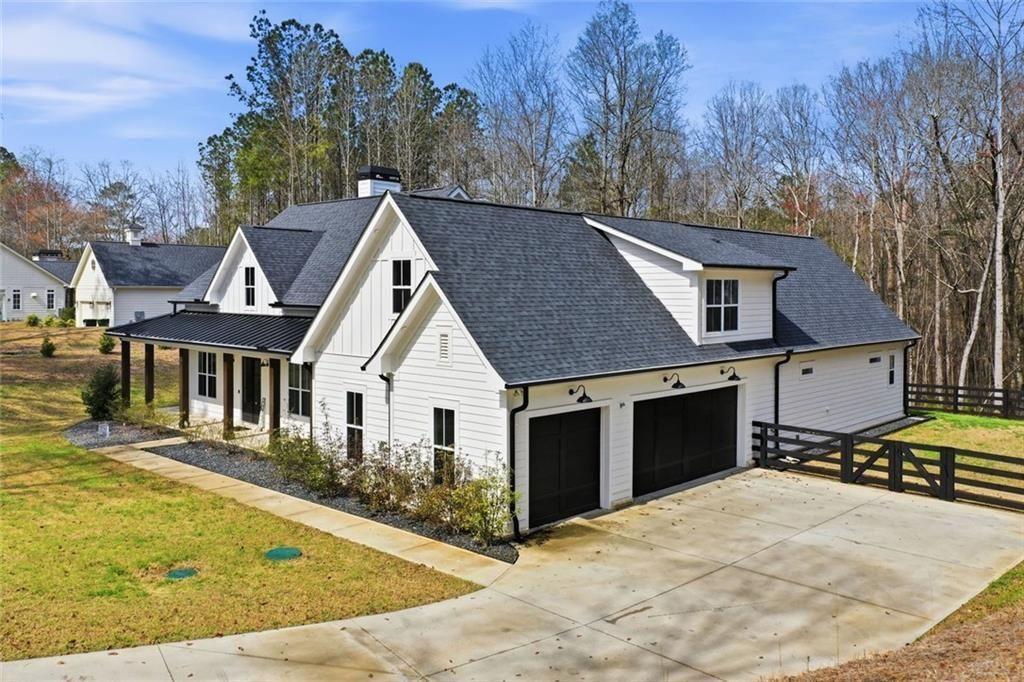 877 Arnold Mill Road Woodstock, GA 30188 - Photo 54 of 62 a view of a house with a yard