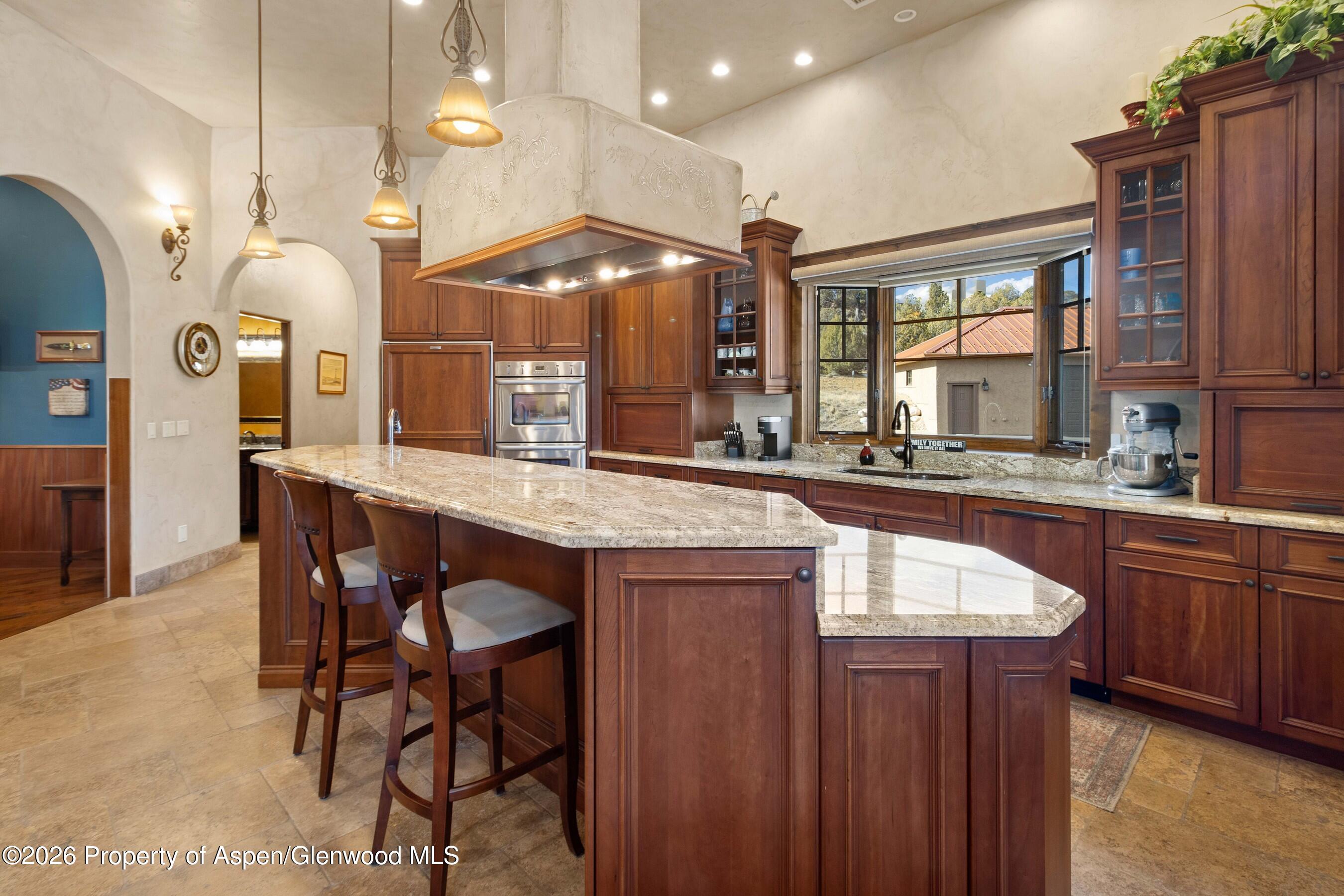 966 Mesa Drive Rifle, CO 81650 - Photo 15 of 54 a large kitchen with a table and chairs
