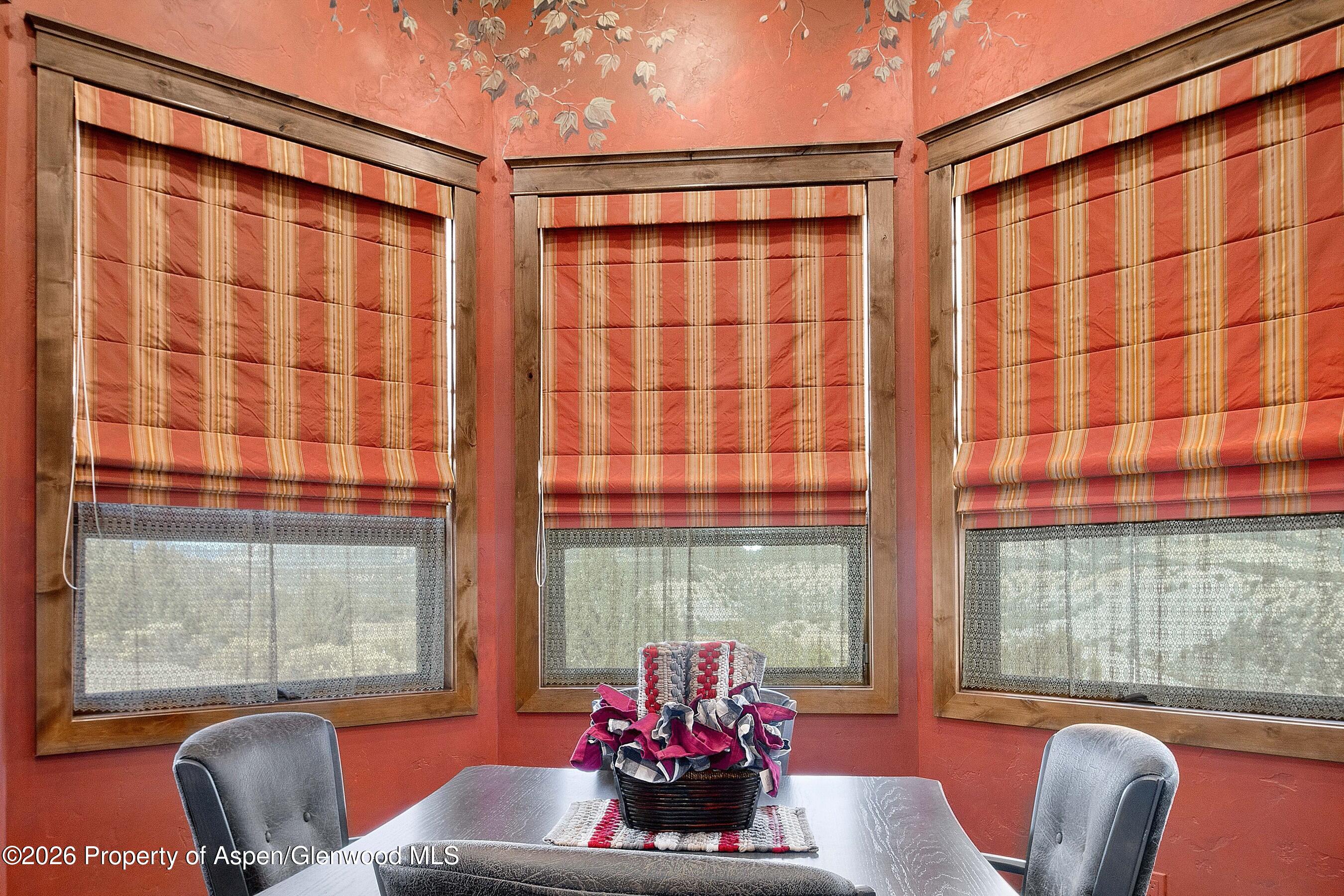 966 Mesa Drive Rifle, CO 81650 - Photo 21 of 54 a view of a dining room with furniture window and outside view