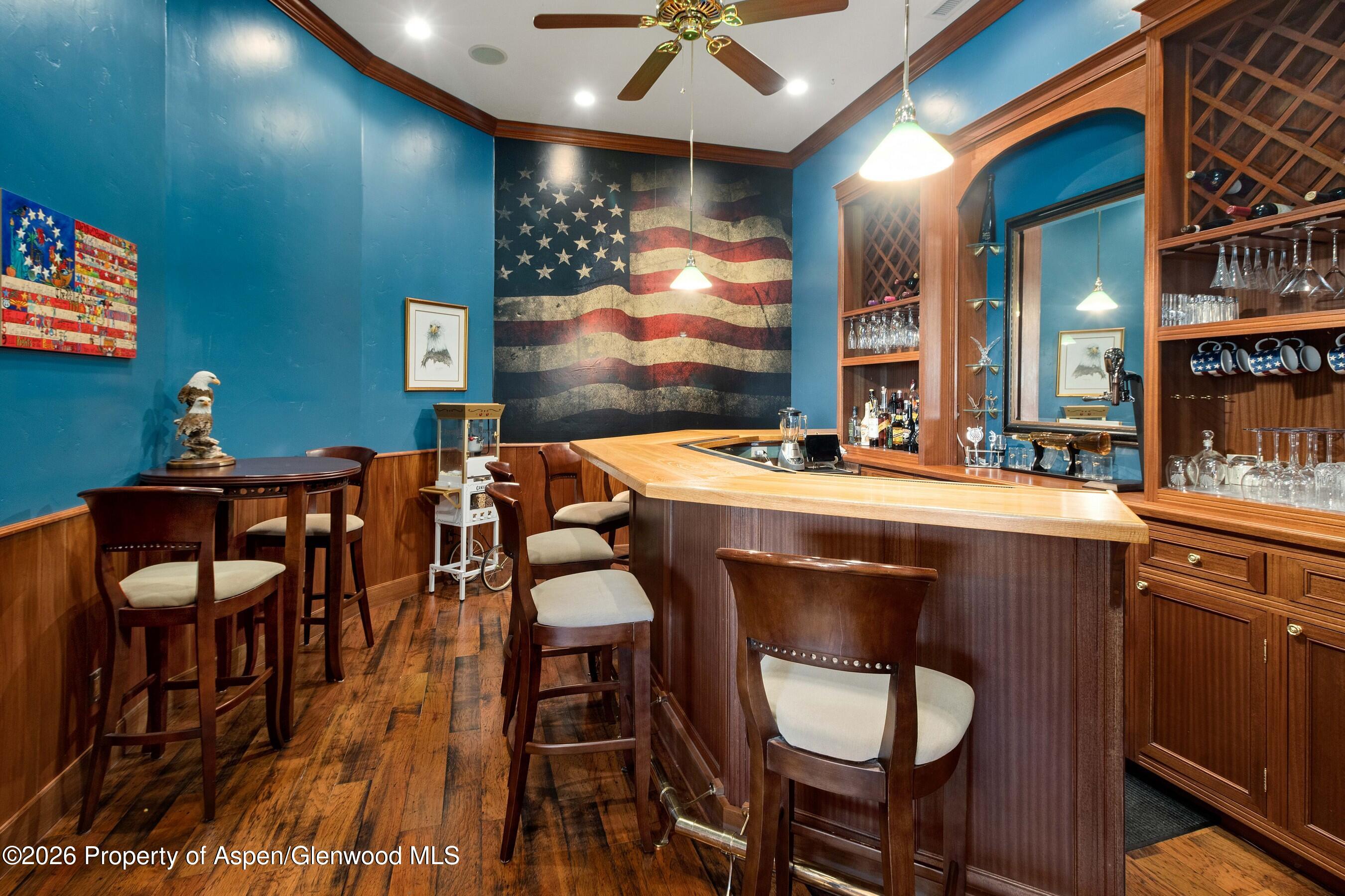 966 Mesa Drive Rifle, CO 81650 - Photo 22 of 54 a room with furniture a rug and a chandelier