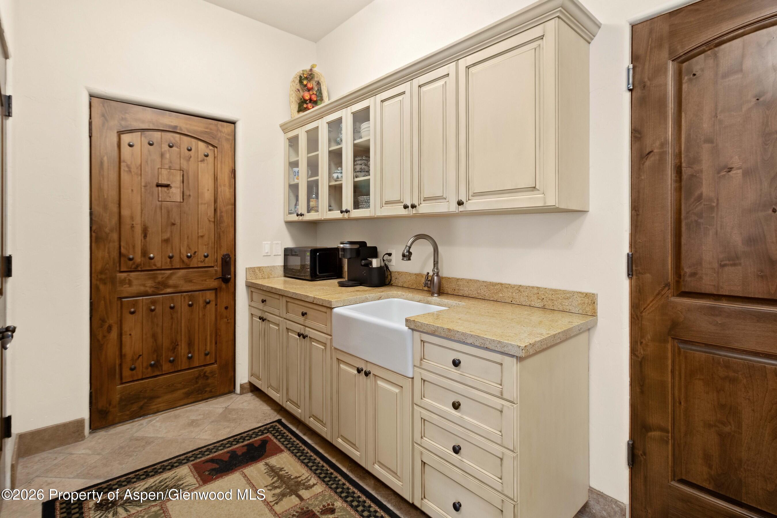 966 Mesa Drive Rifle, CO 81650 - Photo 23 of 54 a kitchen with stainless steel appliances granite countertop a refrigerator sink and cabinets