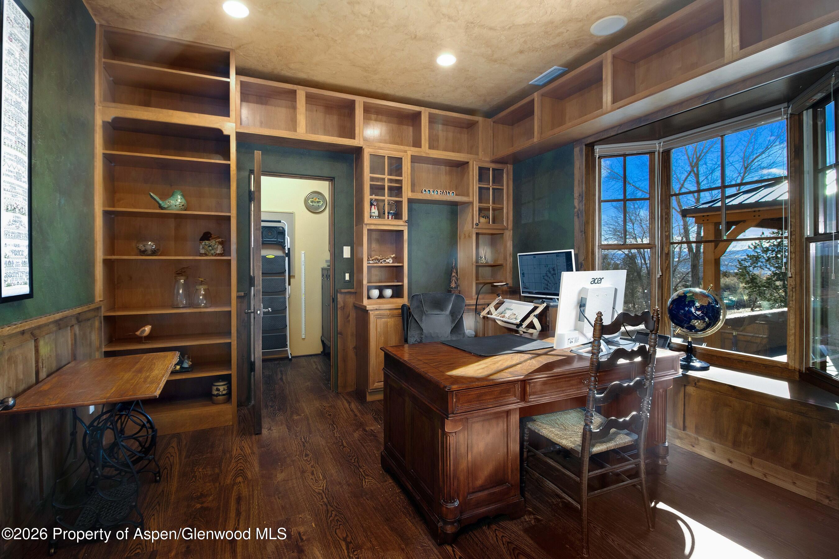 966 Mesa Drive Rifle, CO 81650 - Photo 27 of 54 a dining room with furniture and wooden floor