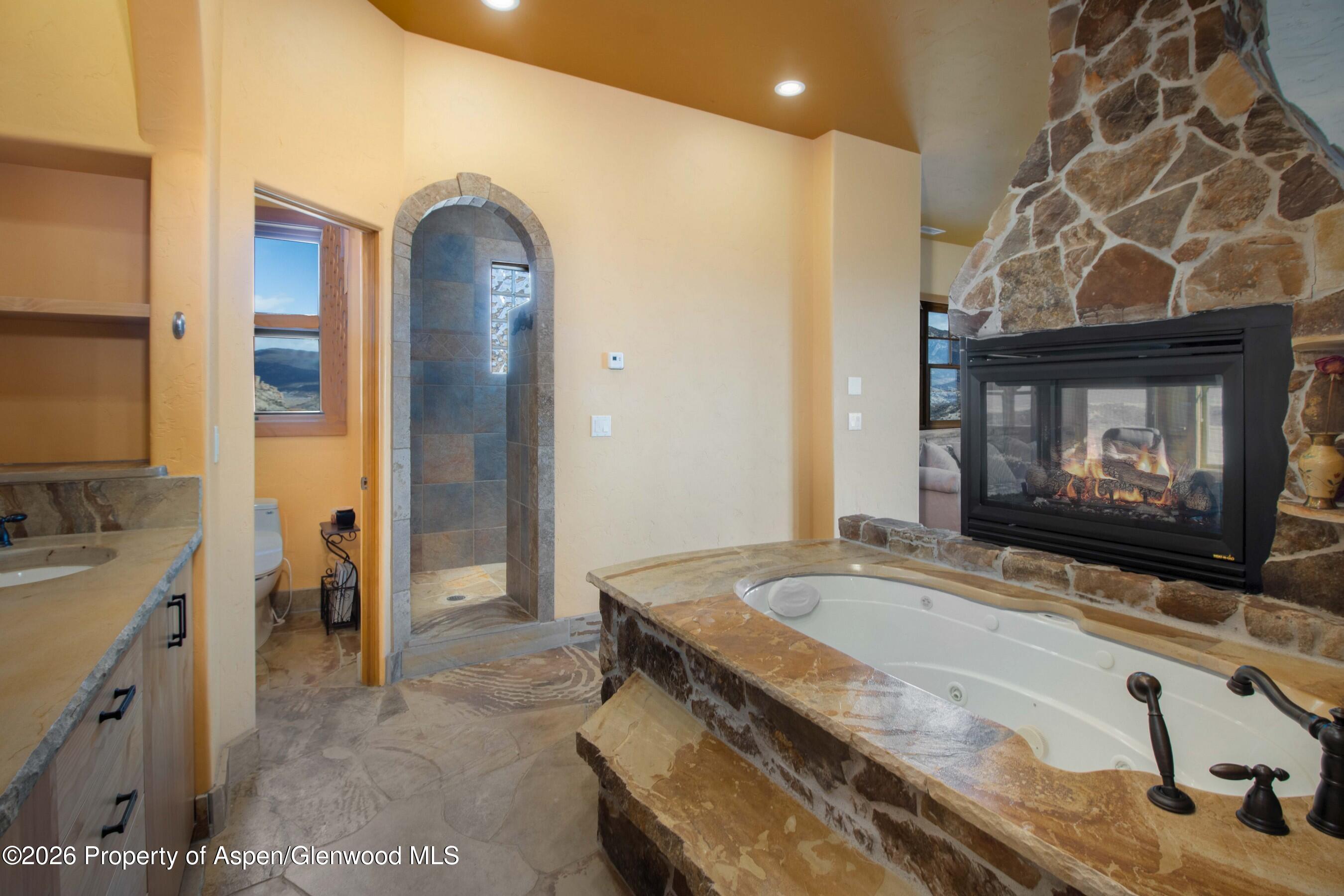 966 Mesa Drive Rifle, CO 81650 - Photo 32 of 54 a bathroom with a sink and a mirror