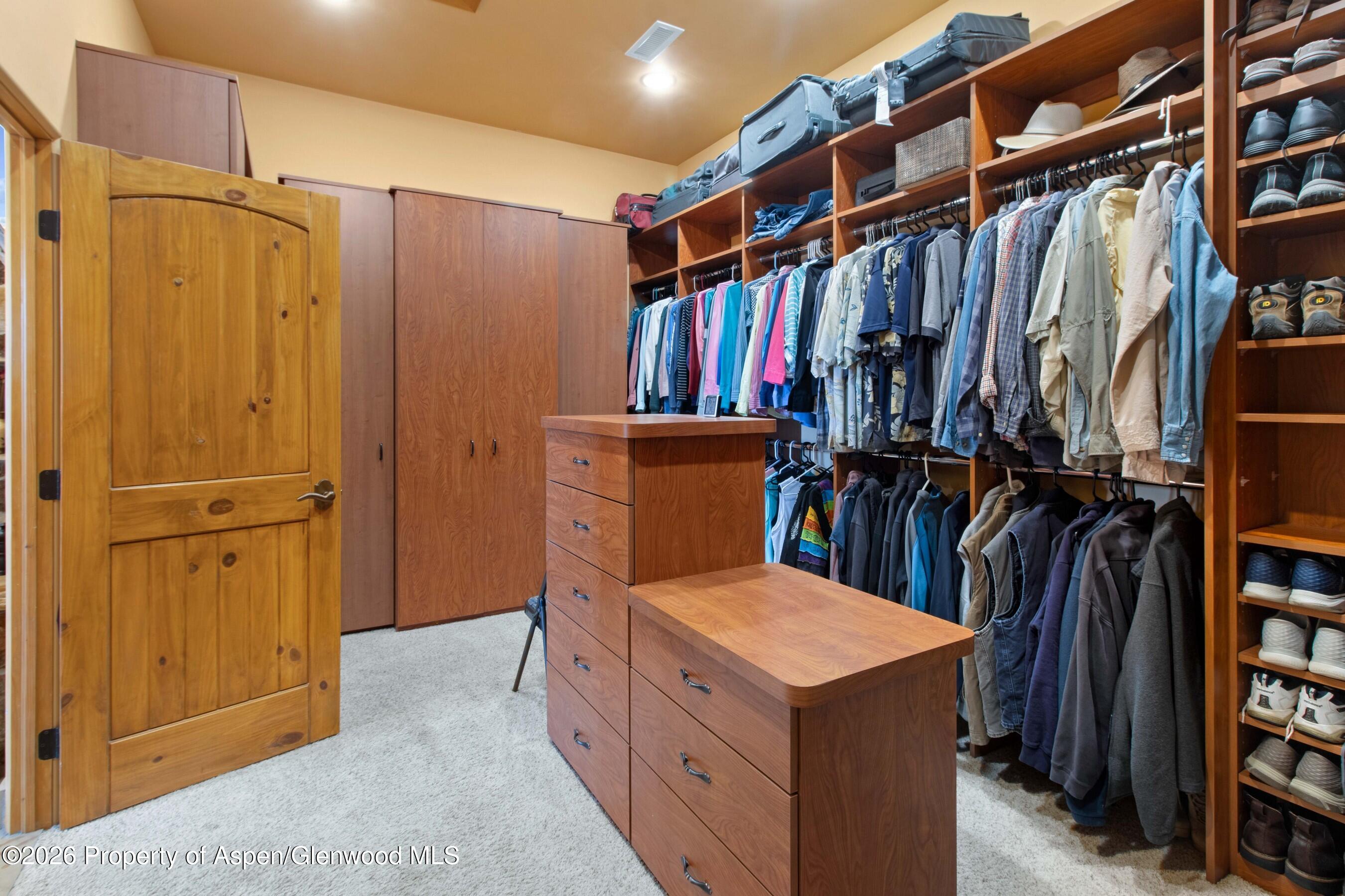 966 Mesa Drive Rifle, CO 81650 - Photo 33 of 54 a view of walk in closet with clothes and shoes
