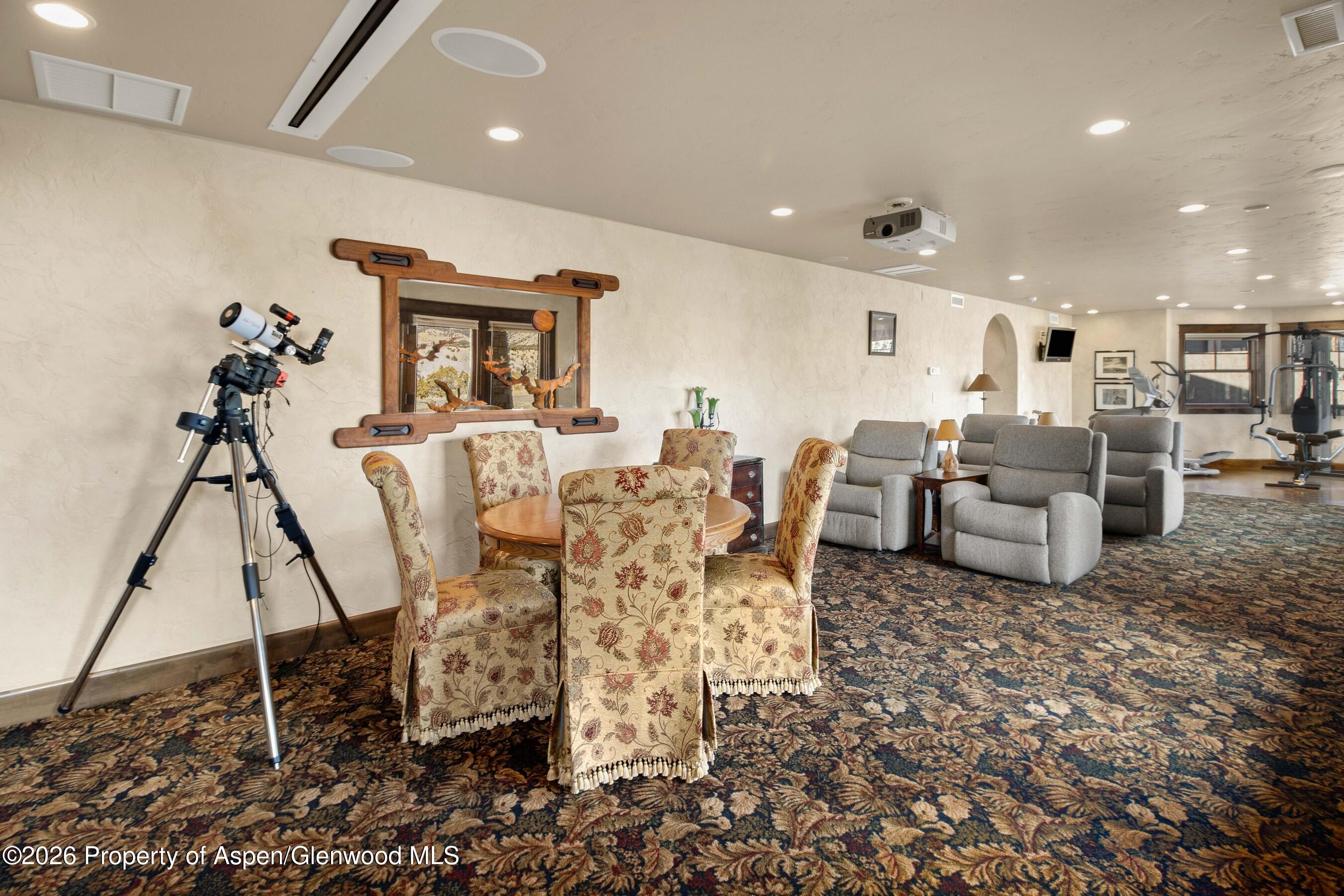 966 Mesa Drive Rifle, CO 81650 - Photo 38 of 54 a living room with furniture and a floor to ceiling window