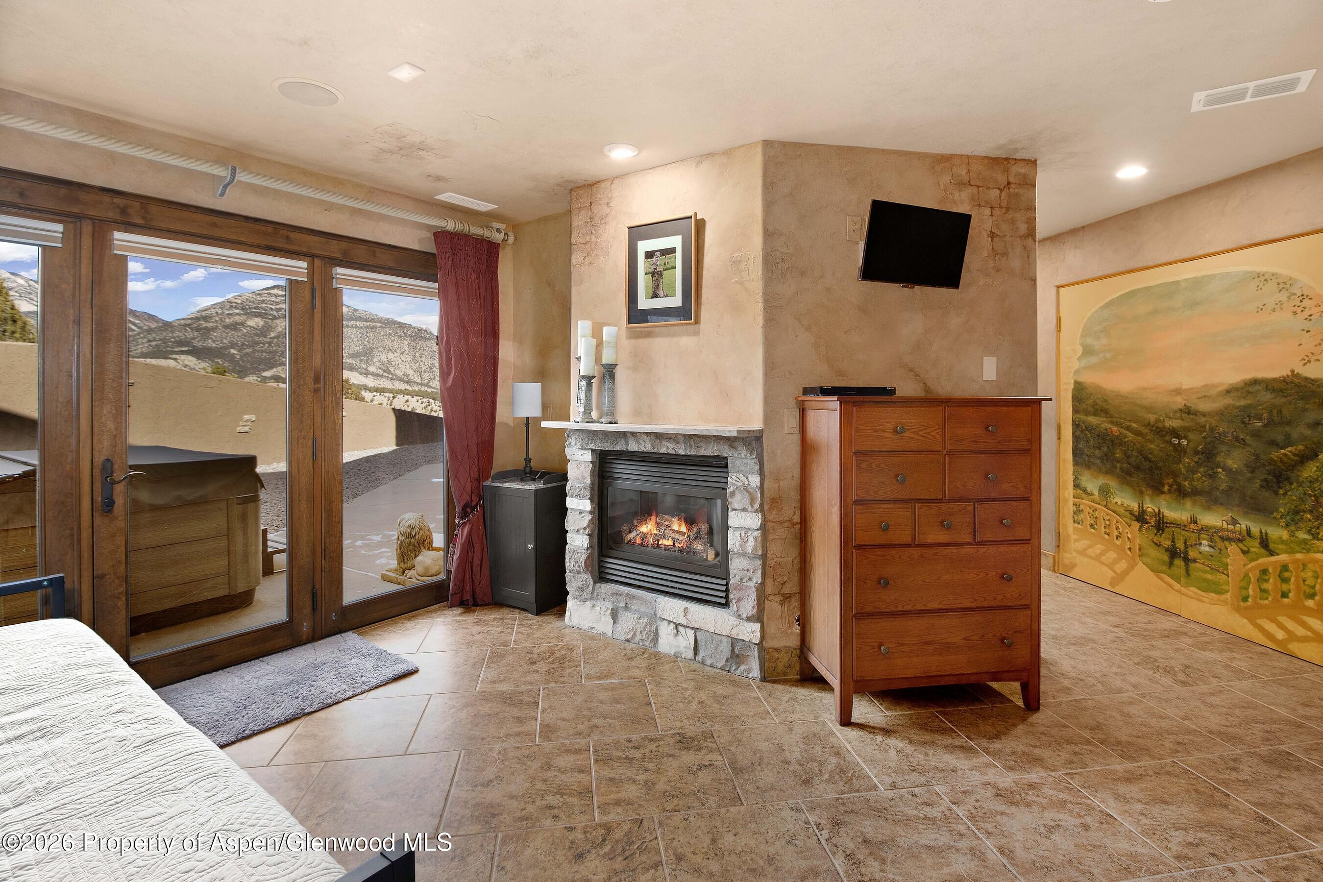 966 Mesa Drive Rifle, CO 81650 - Photo 43 of 54 a living room with furniture and a fireplace