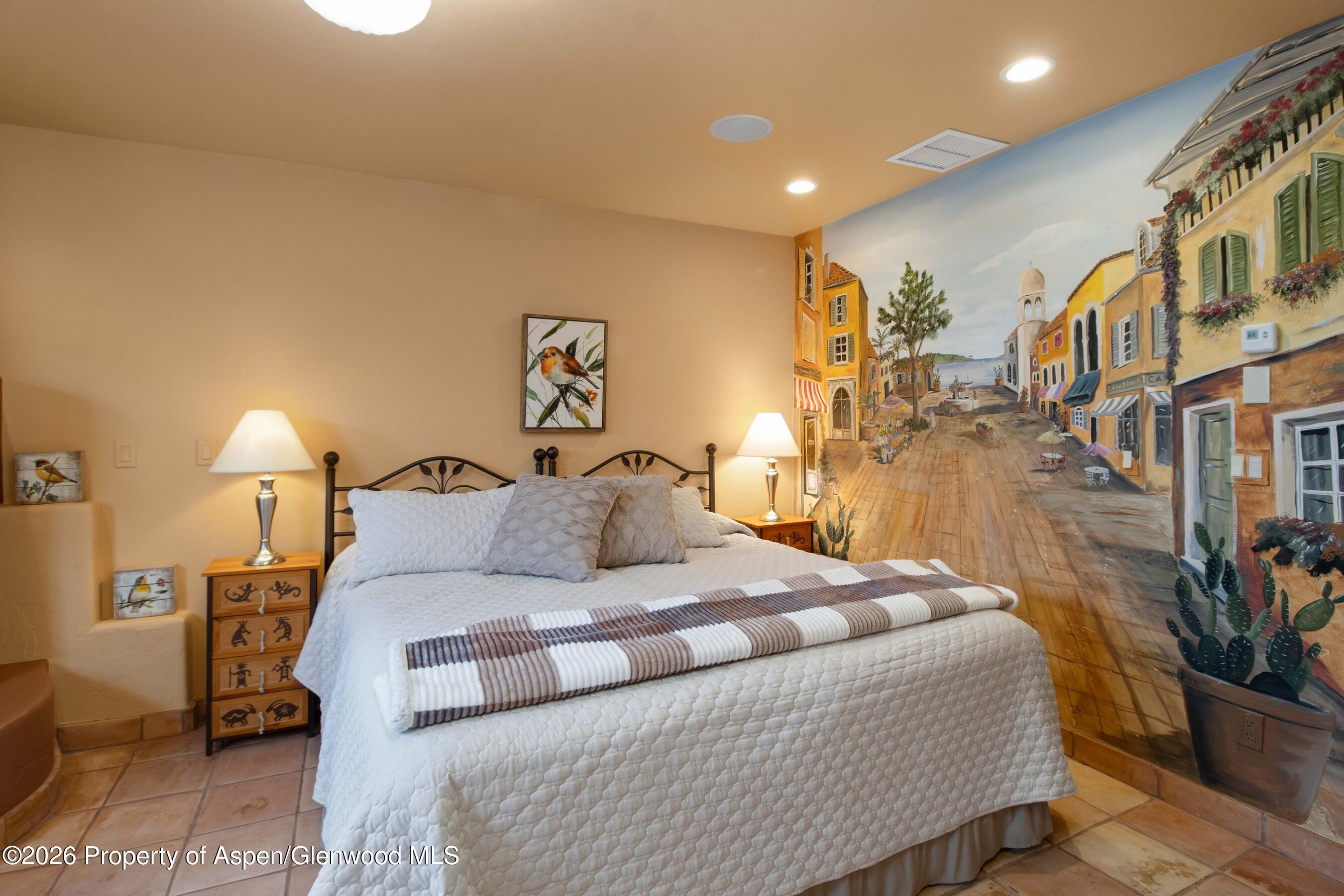 966 Mesa Drive Rifle, CO 81650 - Photo 47 of 54 a bedroom with a bed and a potted plant