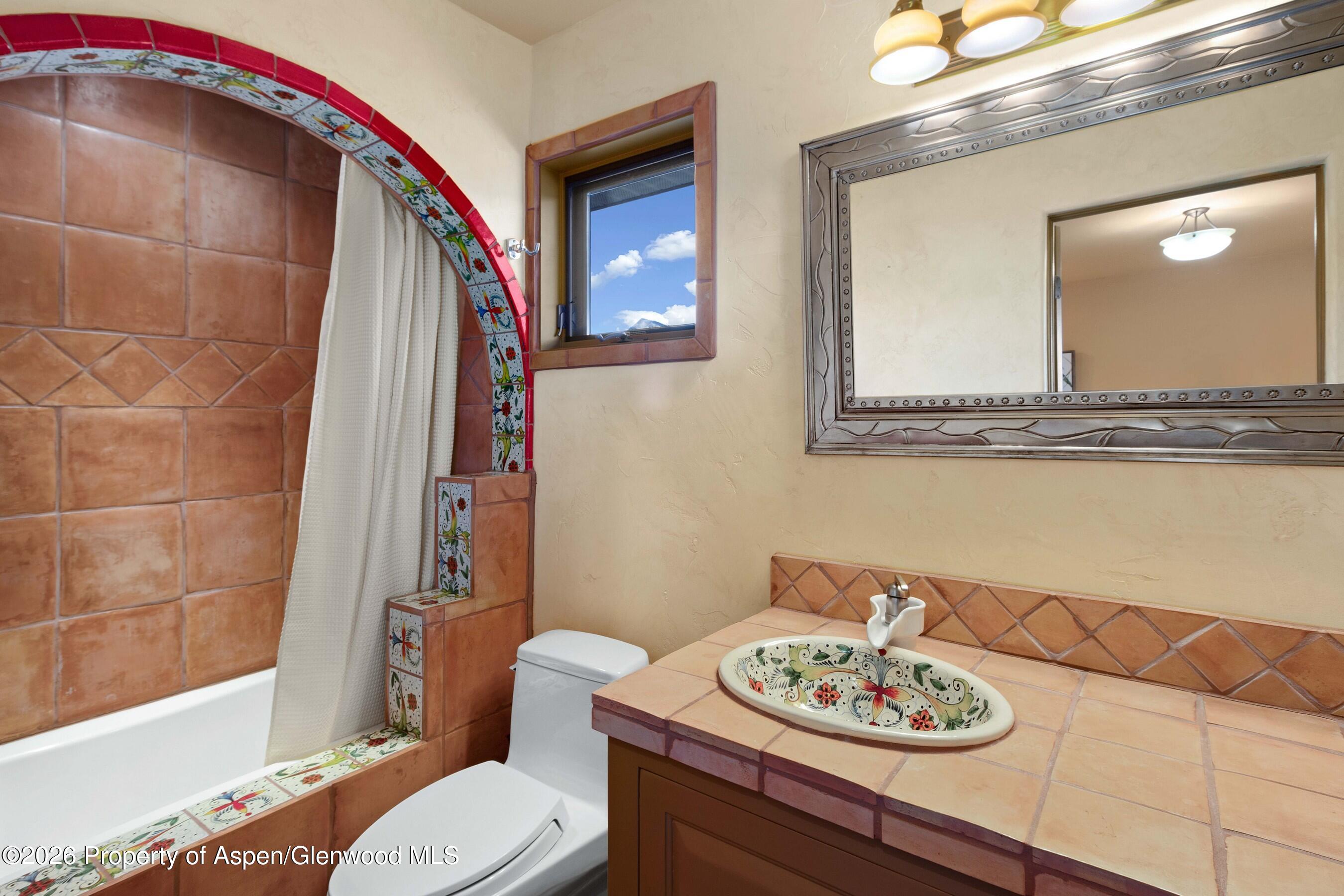 966 Mesa Drive Rifle, CO 81650 - Photo 48 of 54 a bathroom with a sink and a mirror
