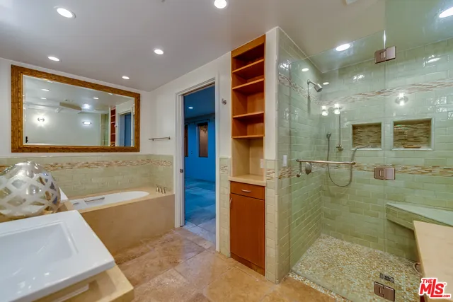a bathroom with a bathtub and a shower
