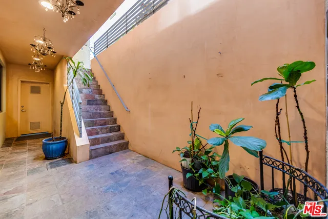 a view of entryway with flower pots