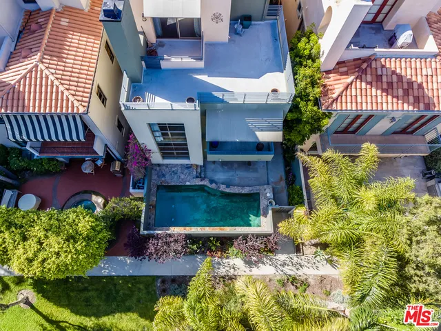 a view of a house with a yard and plants