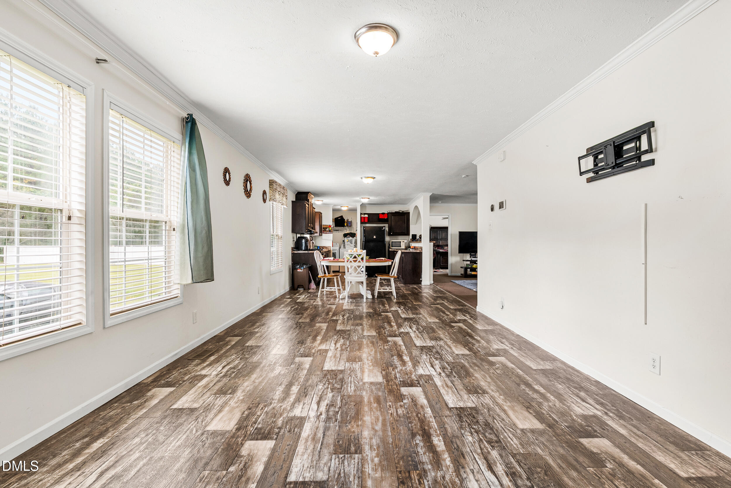 883 Low Ground Road Enfield, NC 27823 - Photo 11 of 26 a living room with furniture and a wooden floor