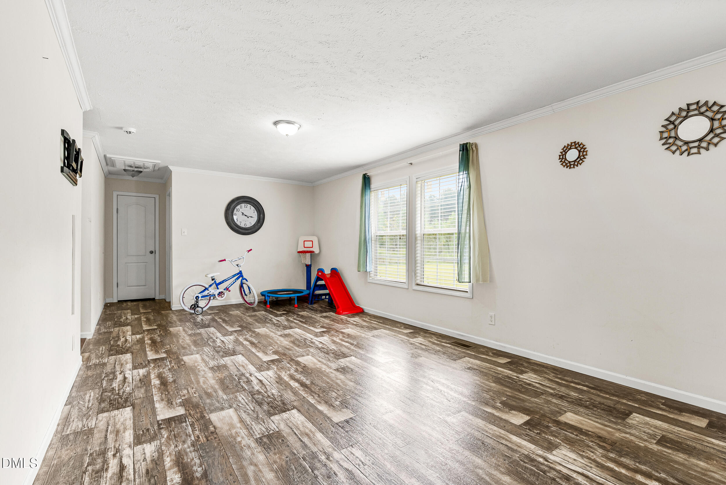 883 Low Ground Road Enfield, NC 27823 - Photo 12 of 26 a view of a room with wooden floor and window