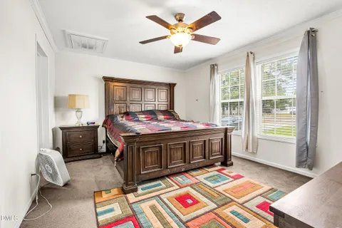 a view of a room with wooden floor and window