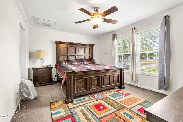 a view of a room with wooden floor and window