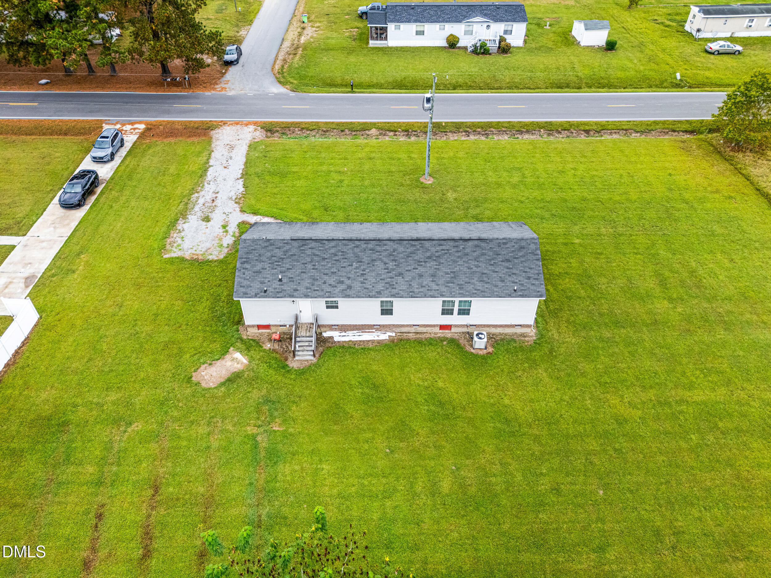 883 Low Ground Road Enfield, NC 27823 - Photo 21 of 26 a view of a swimming pool with a yard